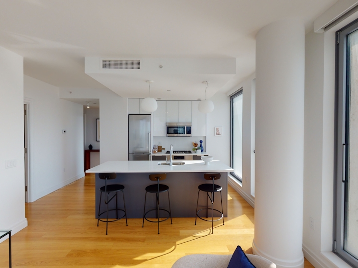 a living room filled with furniture and a flat screen tv