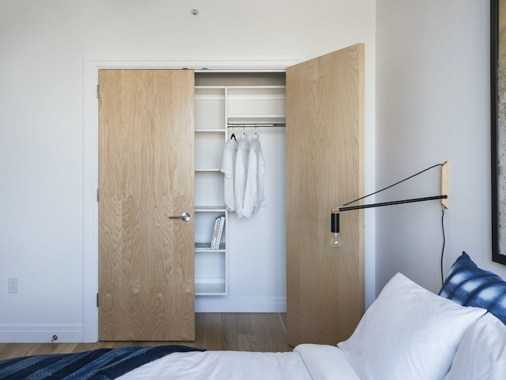 a bedroom with a bed in a room