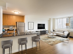 Thumbnail of Atlas New York: 10H a living room filled with furniture and a large window