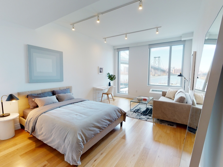 a bedroom with a bed in a room