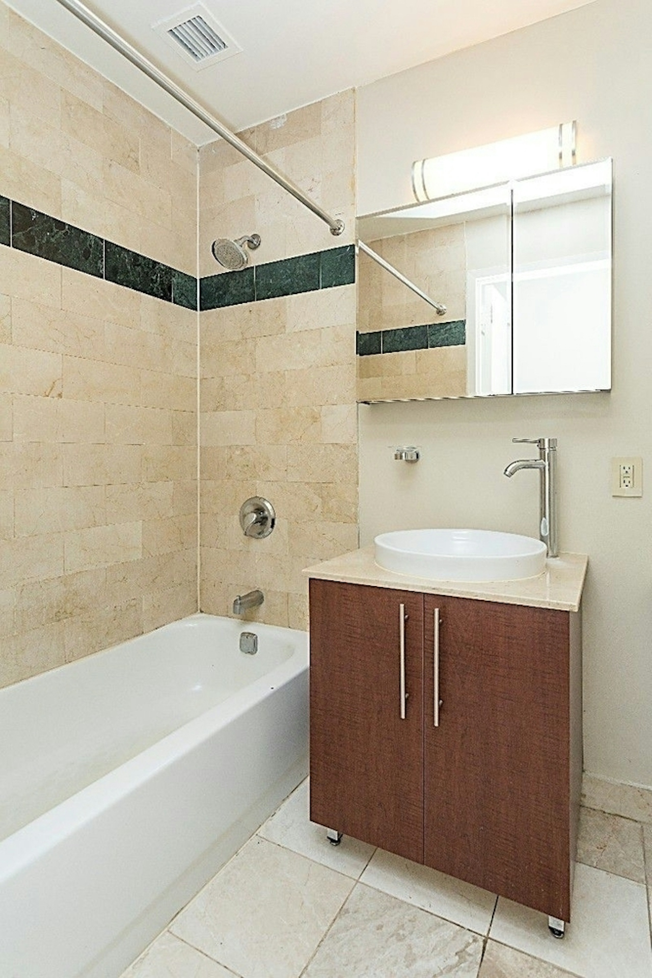 a white tub sitting next to a sink