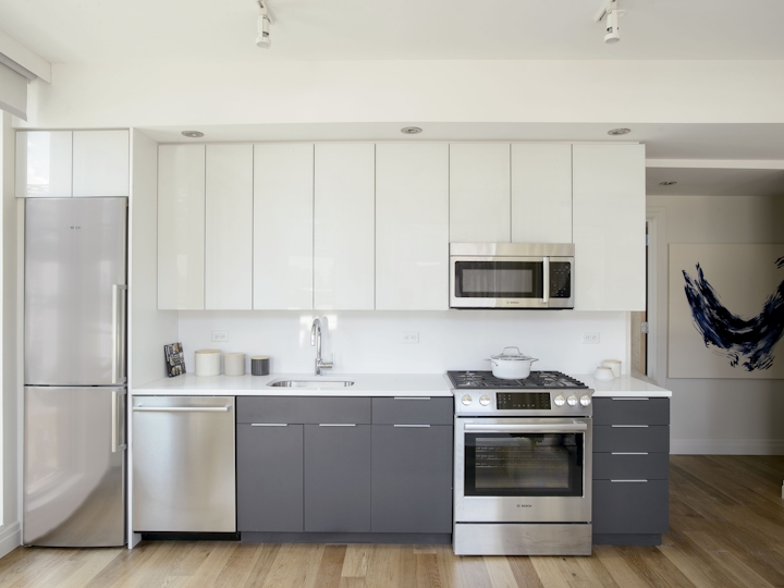 a large white refrigerator in a kitchen