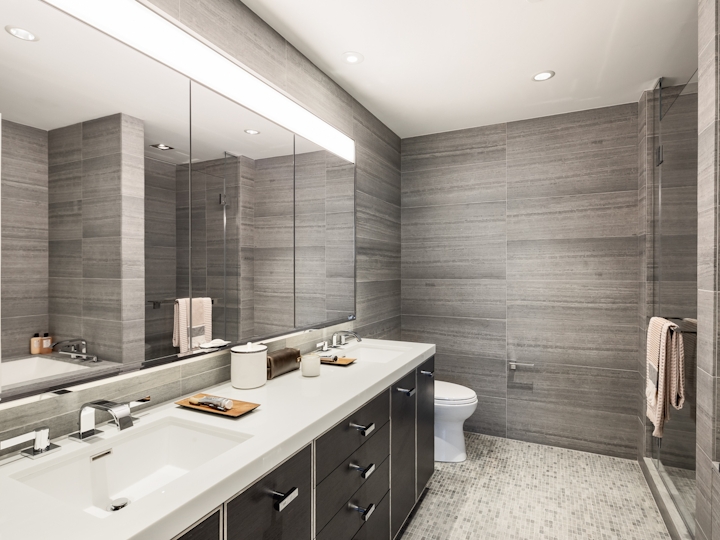a double sink and large mirror