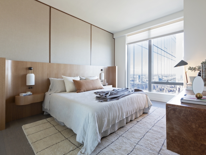 a bedroom with a large bed in a hotel room