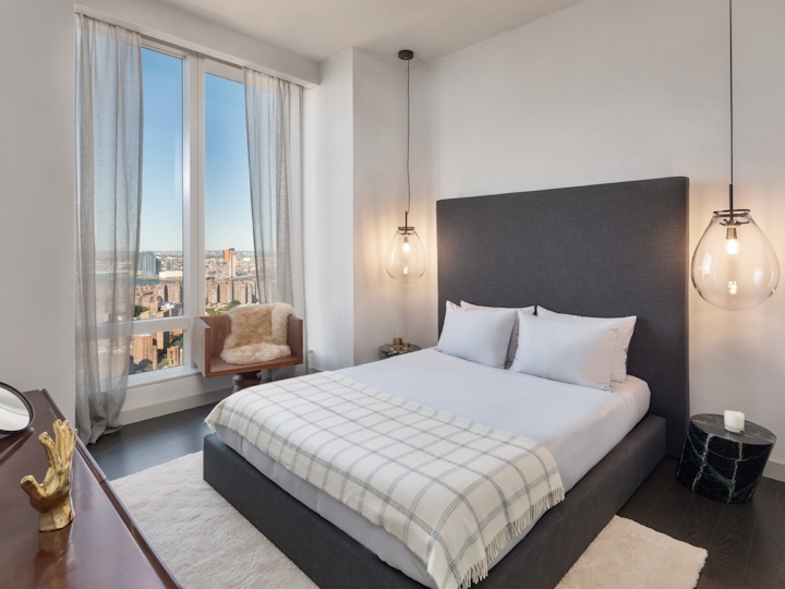 a bedroom with a large bed in a hotel room