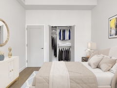 Thumbnail of The Nicole: 3E a bedroom with a bed in a room