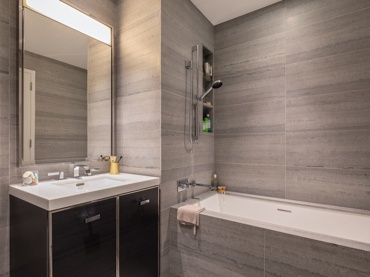a room with a sink and a mirror