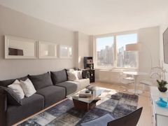 Thumbnail of Gotham West: 2717 a living room filled with furniture and a large window