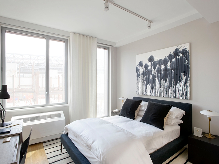 a bedroom with a large bed in a hotel room