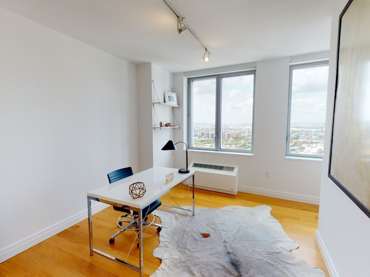 a room filled with furniture and a large window