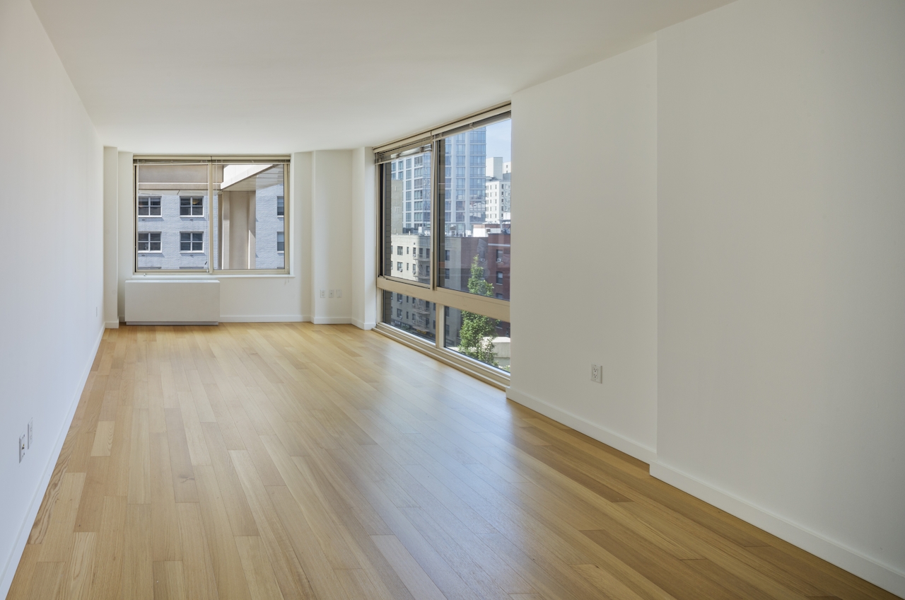 a large empty room with a wooden floor