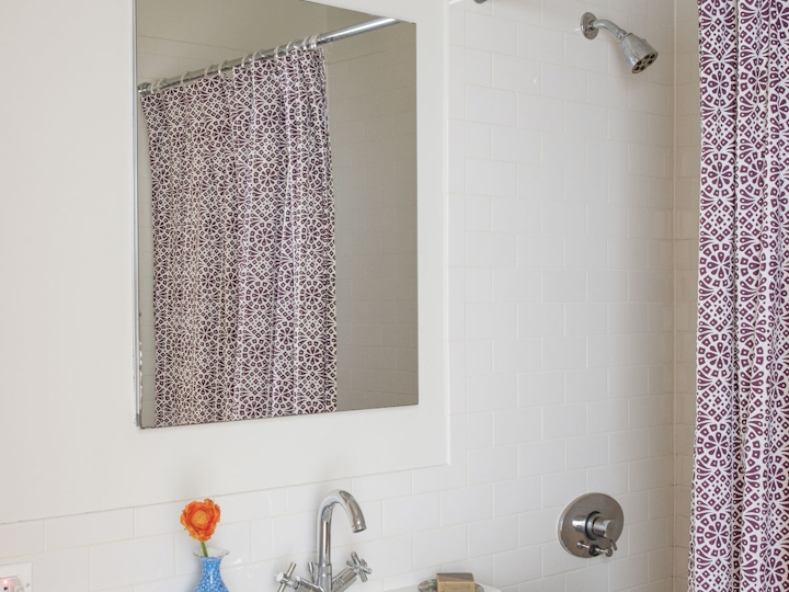 a room with a sink and a mirror