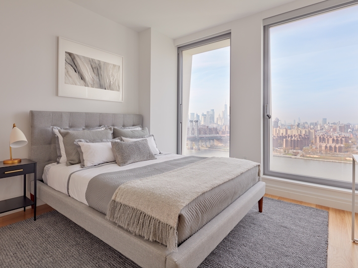 a hotel room with a large bed in a bedroom next to a window
