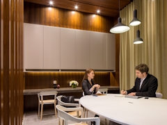 Thumbnail of Gotham West: 2717 a person sitting at a table in a room