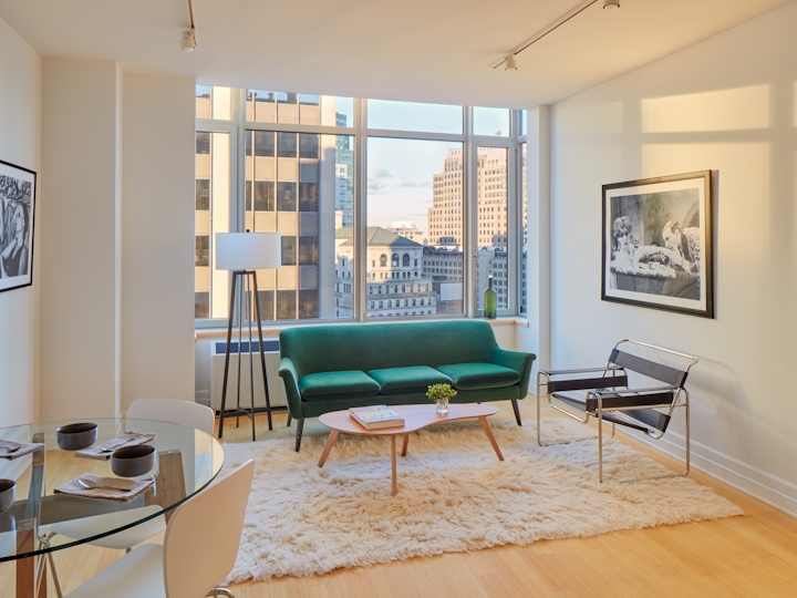 a living room filled with furniture and a large window