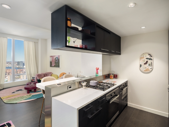 a kitchen with a sink and a mirror