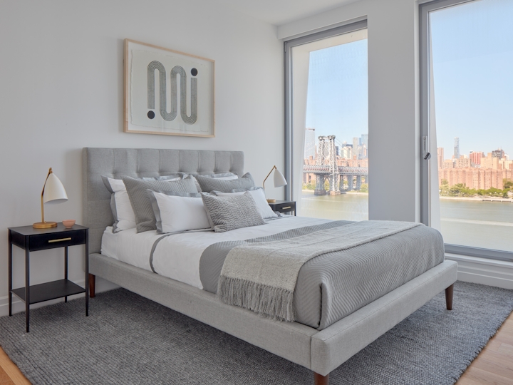 a bedroom with a large bed sitting in a room