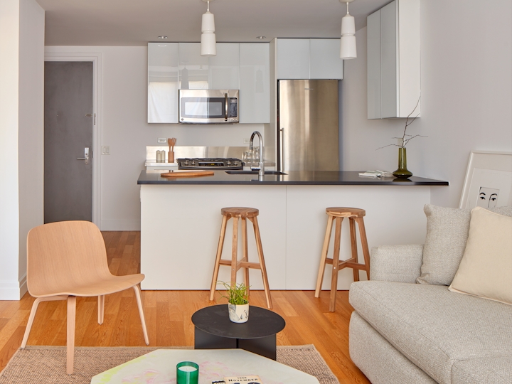 a living room filled with furniture and a table