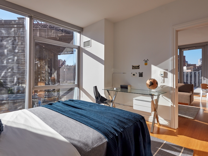 a bedroom with a large window