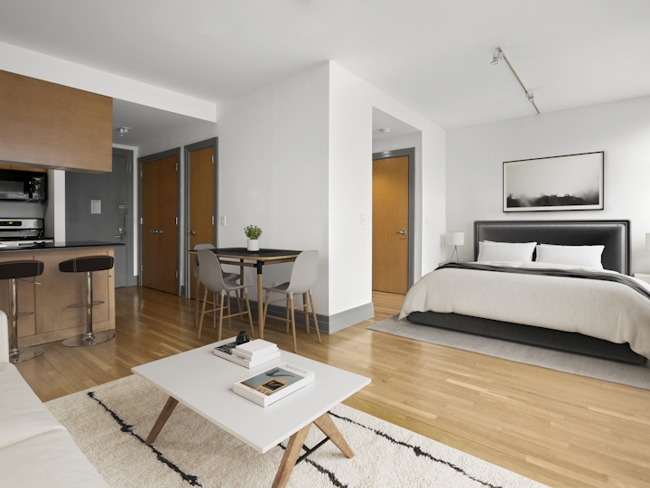 a living room filled with furniture and a flat screen tv