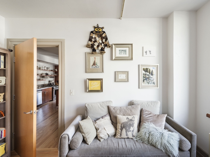 a living room filled with furniture and a flat screen tv