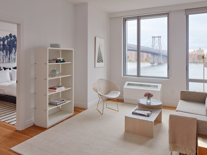 a living room filled with furniture and a large window
