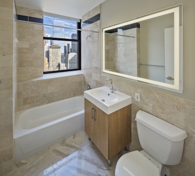 a room with a sink and a mirror