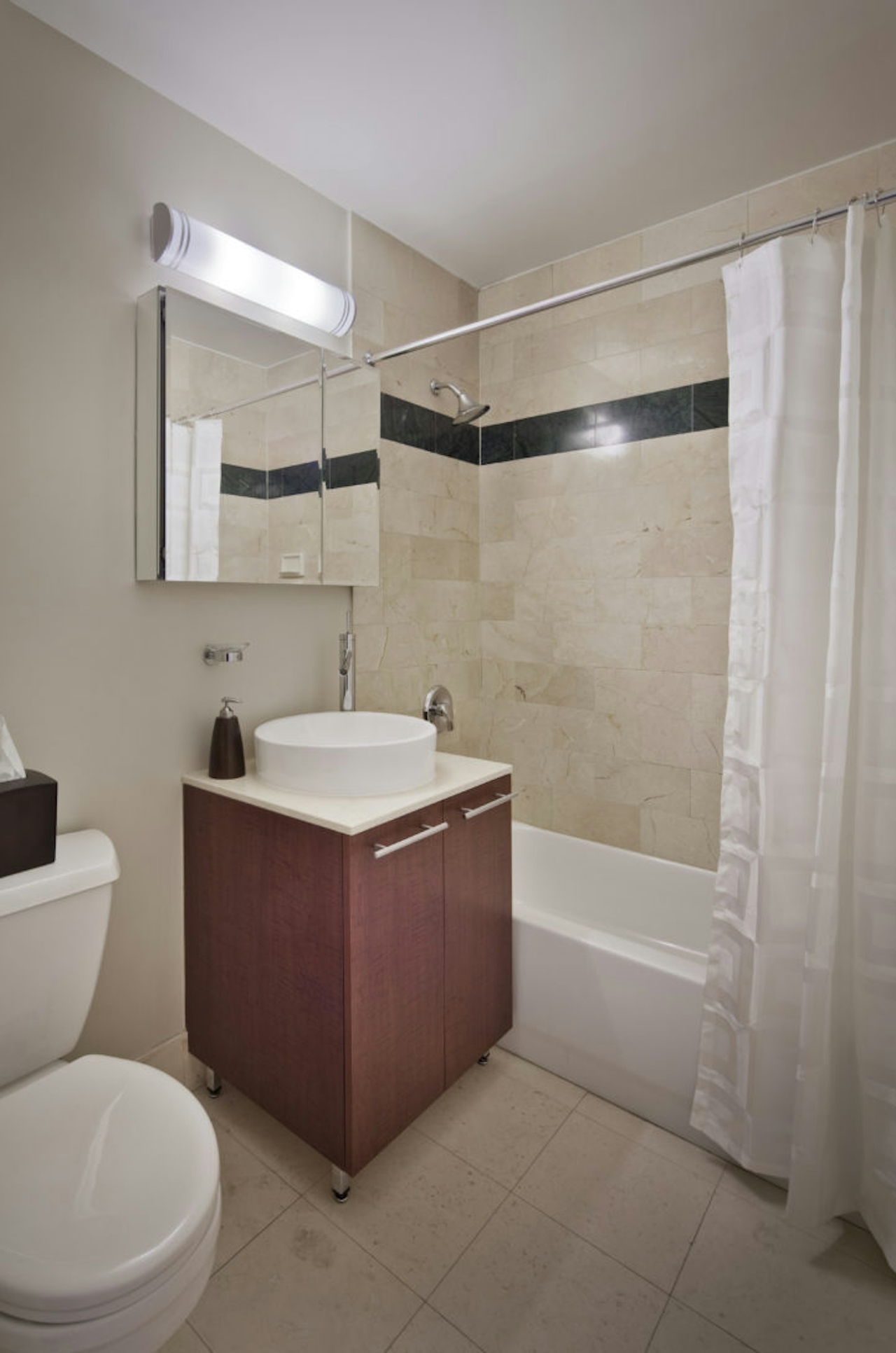 a room with a sink and a mirror