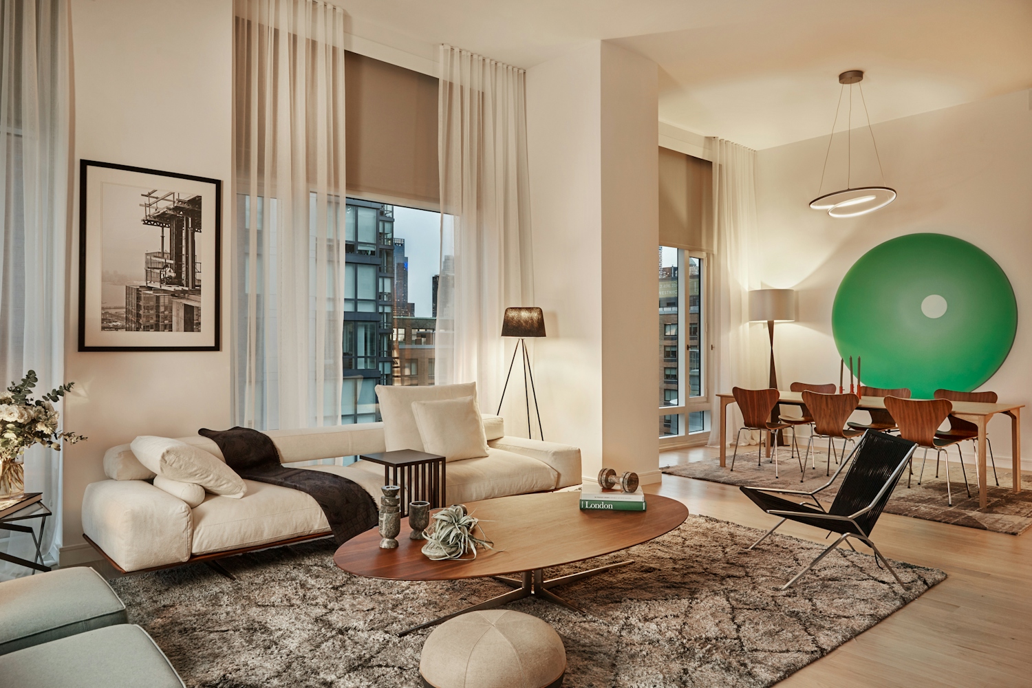 a living room filled with furniture and a large window