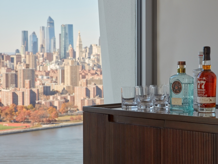 a bottle of water and a city in the background