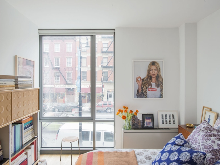 a bedroom with a large window
