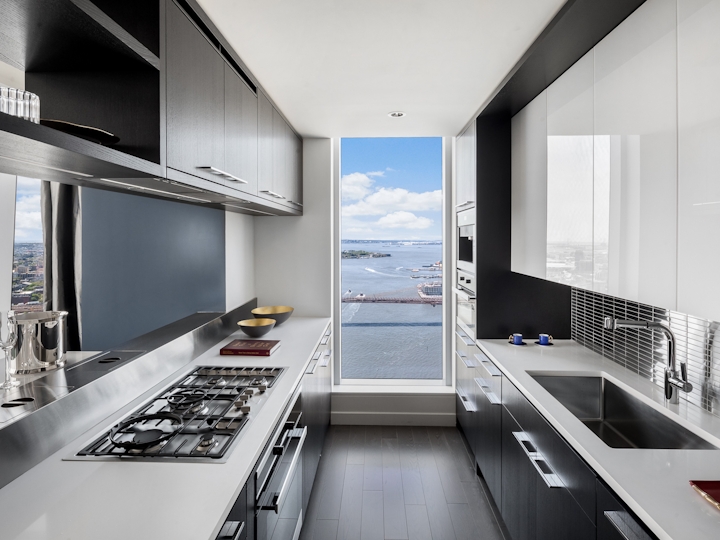 a kitchen with an island in the middle of a room