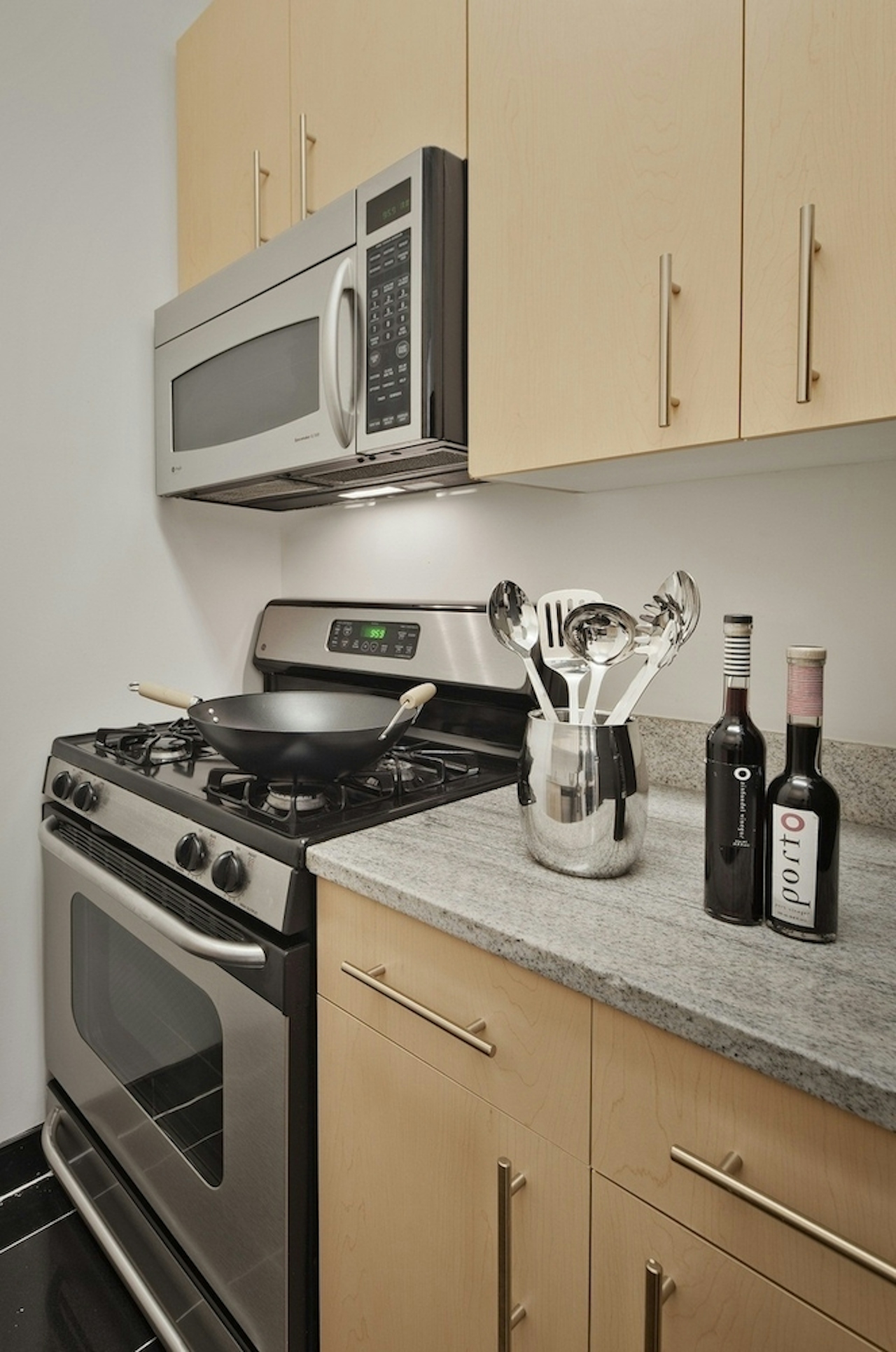 a stove top oven sitting inside of a kitchen