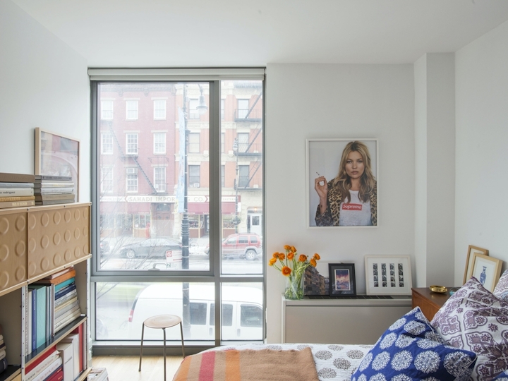 a living room filled with furniture and a large window