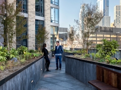 Thumbnail of The Ashland: 38G a person standing on a sidewalk next to a building