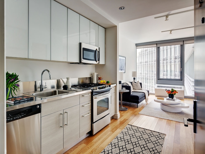 a kitchen with a sink and a microwave