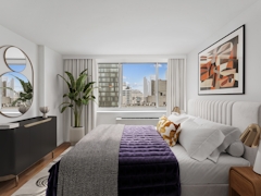 Thumbnail of Atlas New York: 22D a living room filled with furniture and a large window