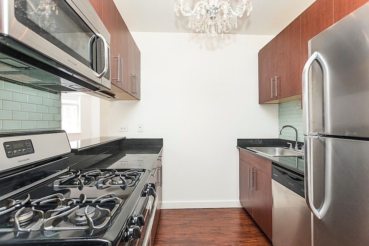 a kitchen with a stove top oven sitting inside of a refrigerator