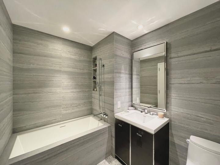 a room with a sink and a mirror