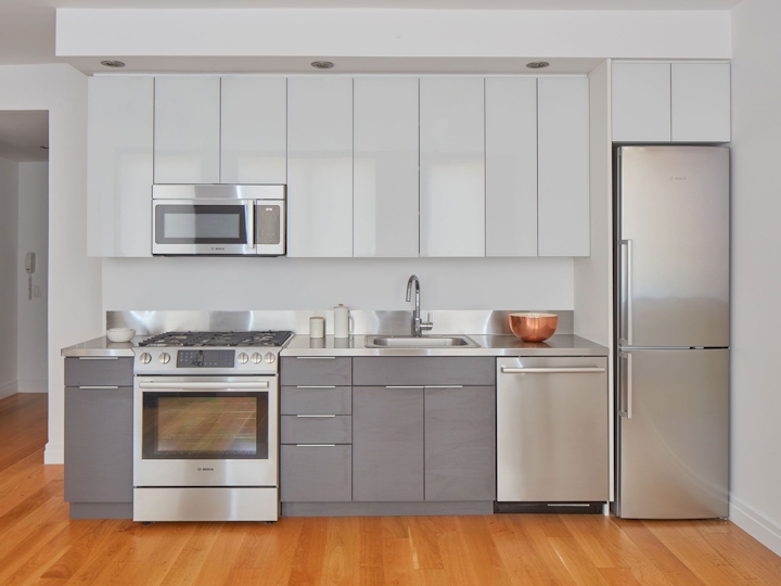 a kitchen with a stove top oven sitting inside of a refrigerator