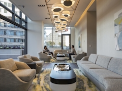 Thumbnail of The Ashland: 38K a living room filled with furniture and a large window