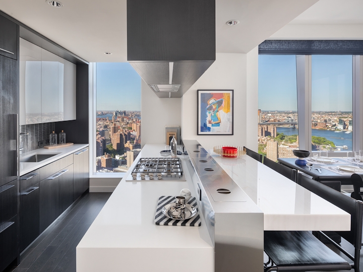 a modern kitchen with an island in the middle of a room