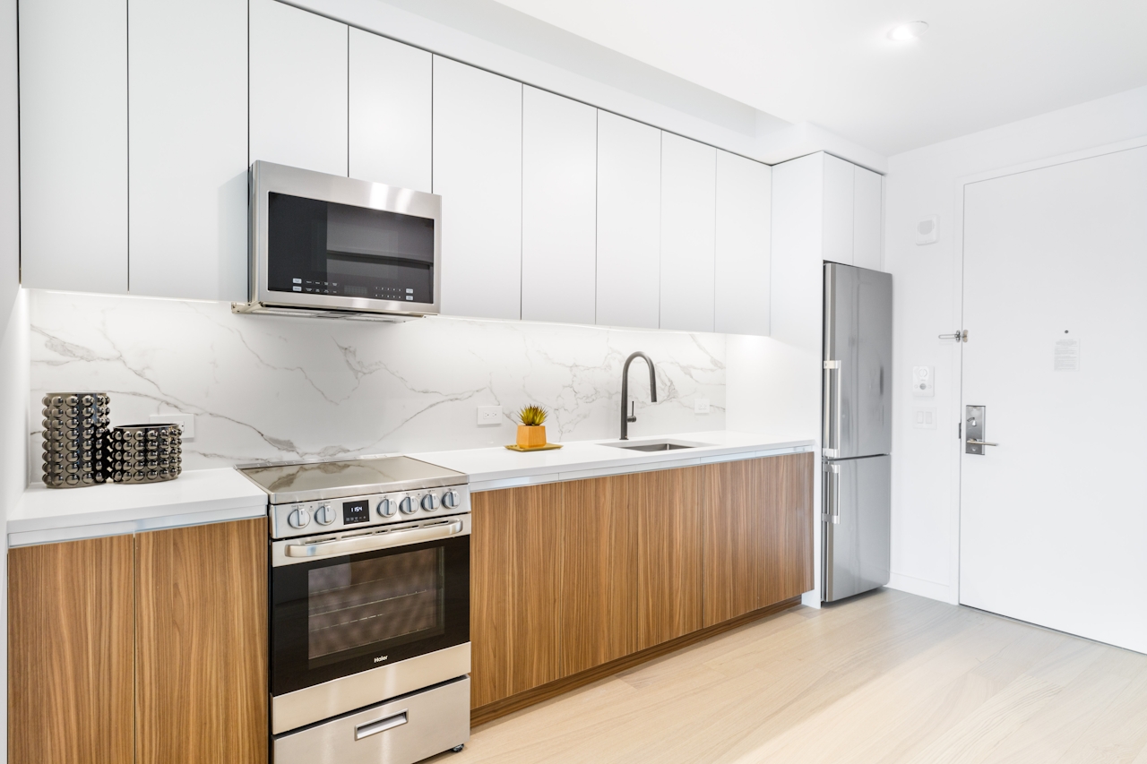 a kitchen with a sink and a microwave