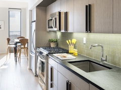 Thumbnail of The Ashland: PH2A a modern kitchen with stainless steel appliances