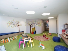 Thumbnail of The Ashland: 38G a living room filled with furniture and a rug