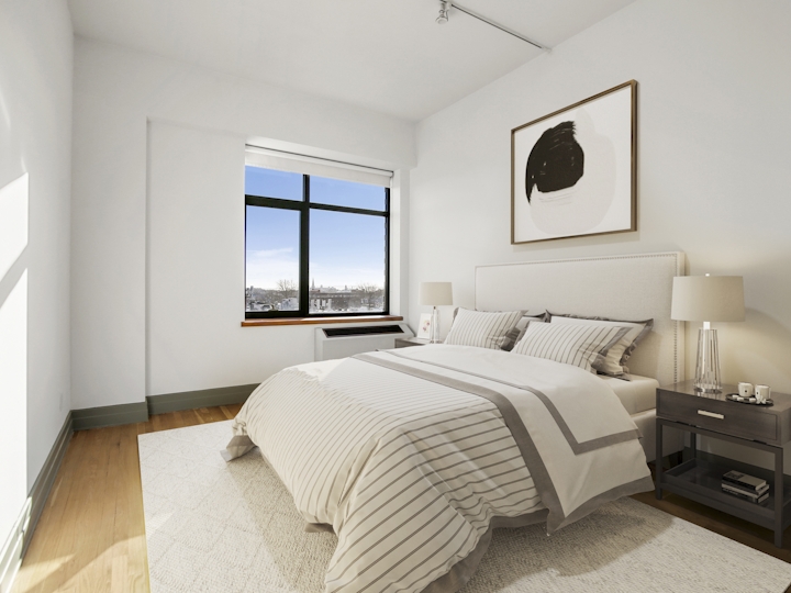 a bedroom with a bed in a room