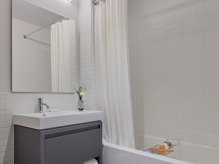 a white tub sitting next to a window