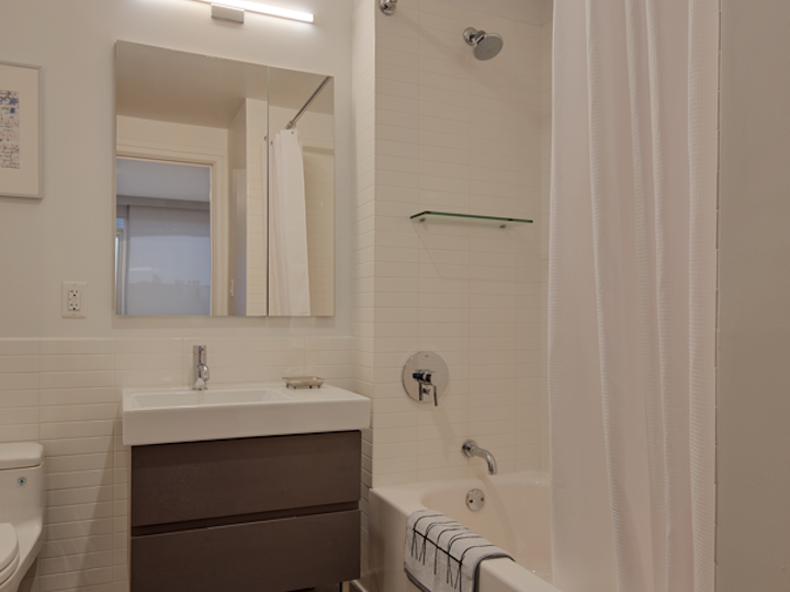 a room with a sink and a mirror