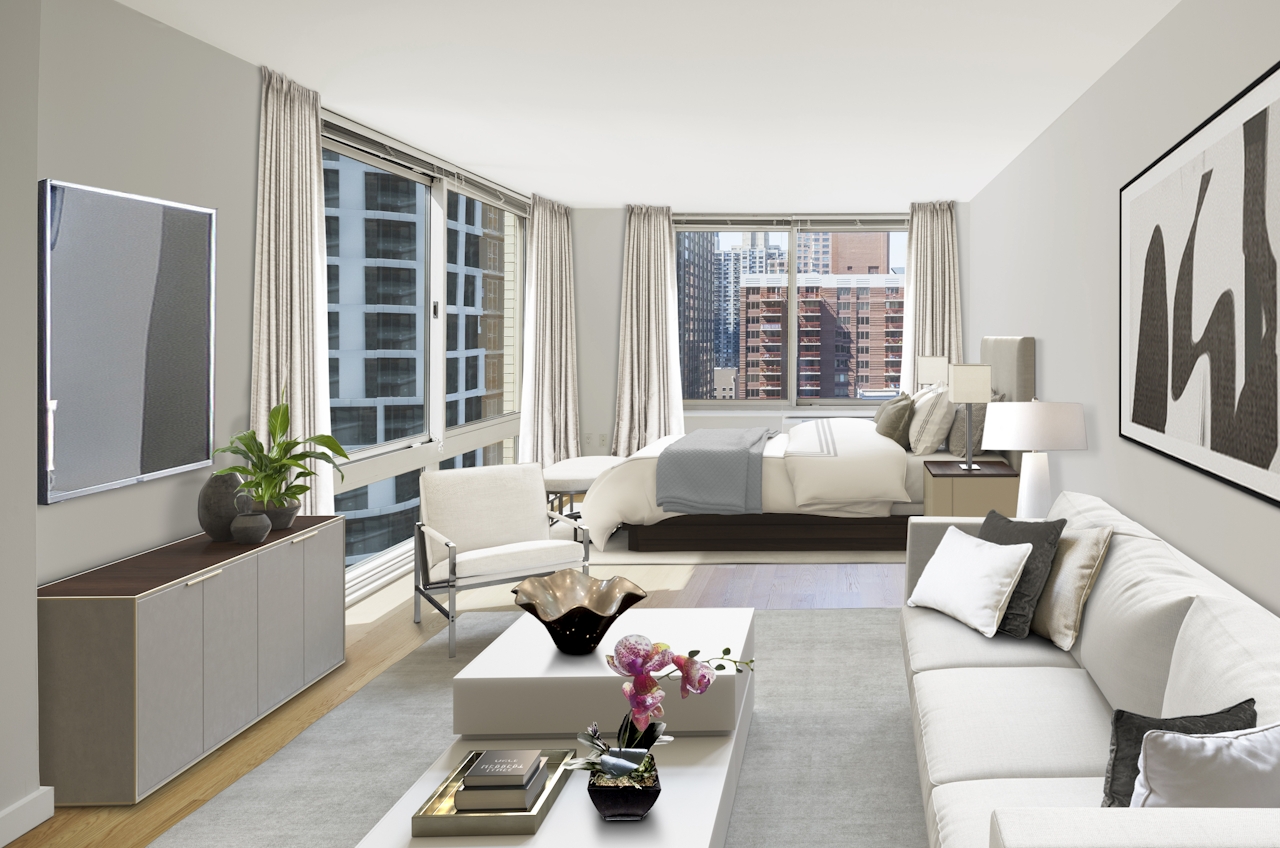 a living room filled with furniture and a large window