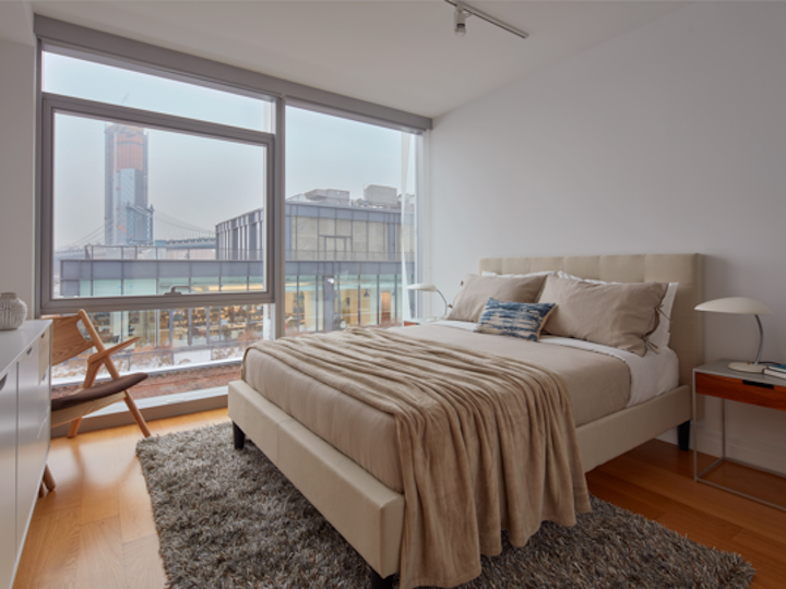 a bedroom with a large bed in a room